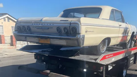 Classic Chevy Impala on a Carsaad Towing flatbed in Norwalk, CA