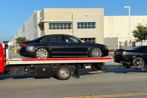 Dual vehicle tow by Carsaad Towing