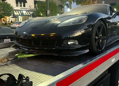 Carsaad Towing flatbed loading a car in Brea, CA