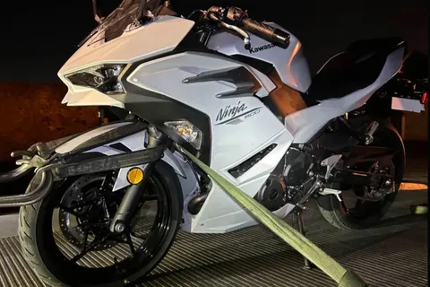 Kawasaki Ninja motorcycle secured for towing