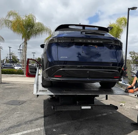 Flatbed tow for a Nissan Ariya near Cerritos, CA in a dealership offering fast and affordable roadside assistance